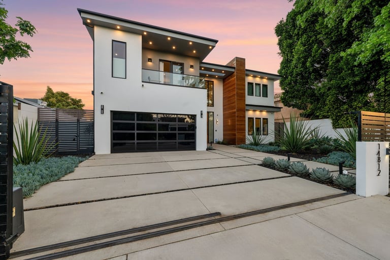 Modern luxury home with clean sparkling windows at twilight